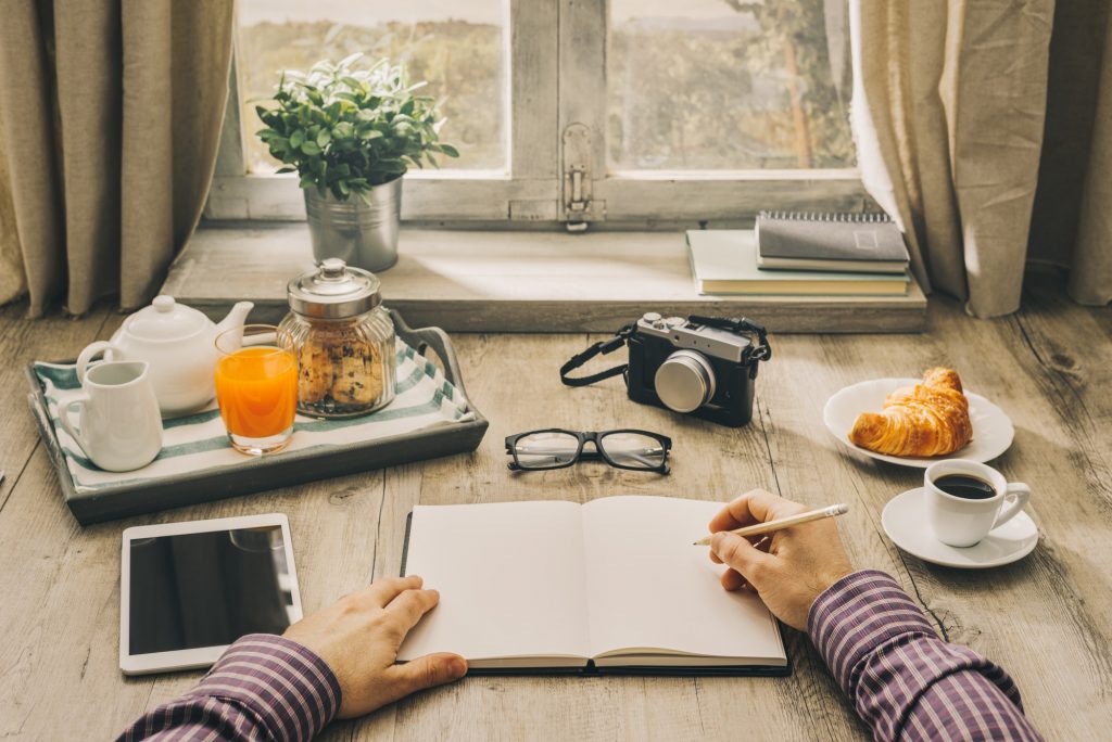 Man writing a journal